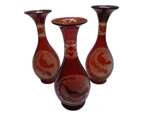 Three early 20th century ruby glass vases with acid etched bird silhouettes, height 28cm. 