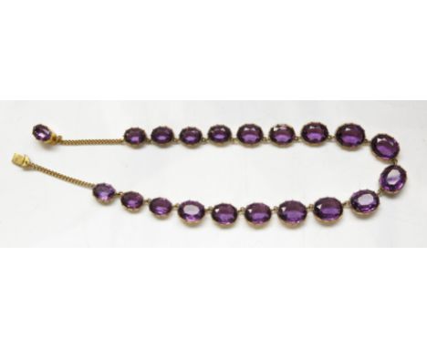 A guilt mounted amethyst necklace.