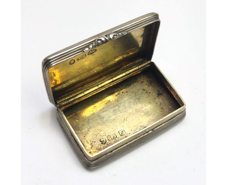 A George lV silver engine turned snuff box with chased thumb piece by Thomas Shaw, Birmingham 1827, width 50mm.