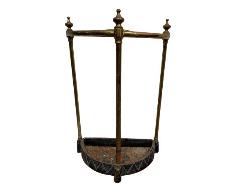 A cast iron and brass half round umbrella stand. From the estate of Ashley Barker OBE who was born in Hertfordshire in 1927.B