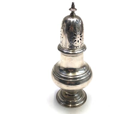 An Irish pierced silver sugar dredger in the form of an urn by West & Son, 6oz, height 16.5cm.From the estate of Ashley Barke