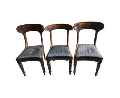 A harlequin set of nine William IV mahogany dining chairs, each with a wide crest rail carved with scrolling and decanthus.  