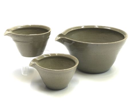 A set of three Nic Harrison green-glaze ceramic pouring bowls, height 12cm, diameter 22cm and smaller, together with a St.Agn