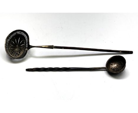 A toddy ladle with spiral baleen handle and a late 18th century continental pierced ladle with baleen handle 