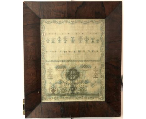 A 19th century sampler by Ann Morton, dated 1842, incorporating religious text and depictions of flowers and trees etc,  41 x