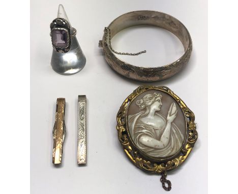 A Cornish Stone Co. silver ring set an amethyst, a silver bangle, a gilt mounted Victorian cameo brooch and two other pieces.