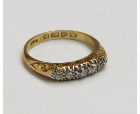 An 18ct early 20th century Chester hallmarked gold ring set with five graduated diamonds. Condition Report: 3.1g 