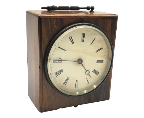 A mahogany mantel clock, circa 1900, with a metal carrying handle, height 18cm, width 15cm.