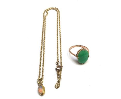 A 9ct gold chain with a gold mounted Opal pendant together with a 9ct gold Jade set ring.