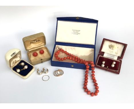 A pearl set 9ct gold ring and two pairs of pearl earrings together with a pair of coral earrings in Ciro box and a coral neck