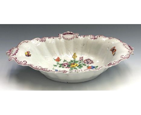 A Plymouth porcelain oval dish with rococo scroll and shell moulded border, painted with floral sprays and butterflies, vario