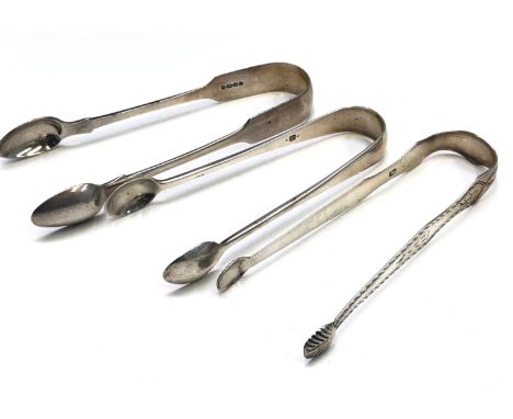 A pair of Georgian bright cut silver sugar tongs by John McFerlan together with two other pairs of silver sugar tongs, 3.4oz.