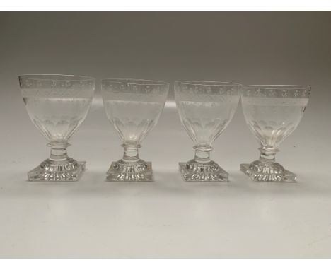 Four Regency glass rummers, each with etched decoration to bowl, capstan stem and moulded square 'lemon squeezer' foot, heigh