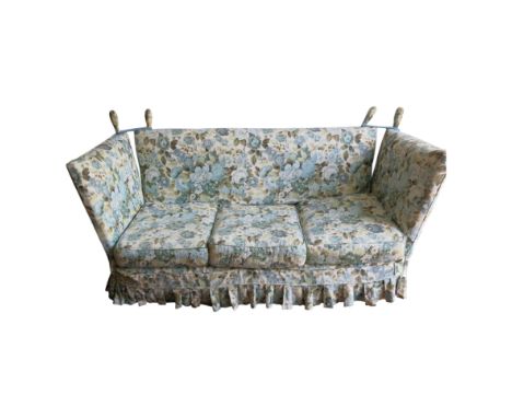 A Knole blue floral upholstered three-seater sofa, with rope-tied ends and folding sides,height 87cm, length 191cm, depth 77c