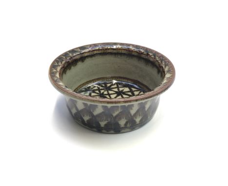 A hand-painted green and brown ceramic glazed bowl by Nic Harrison, height 7cm, diameter 18cm.From the estate of Ashley Barke