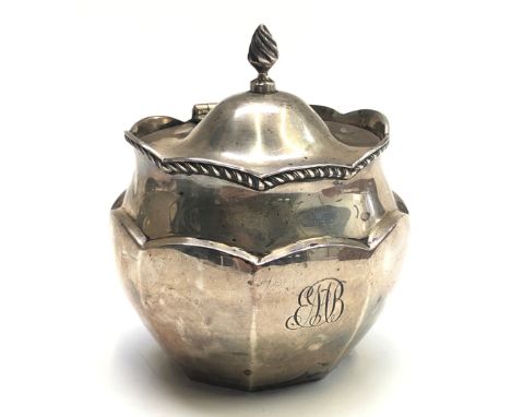 A late Victorian silver hexagonal section tea caddy the higed lid with flambeau finial and with shaped gadrooned rim Birmingh
