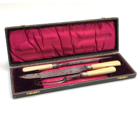 A silver mounted, bone handled carving set, cased. From the estate of Ashley Barker OBE who was born in Hertfordshire in 1927