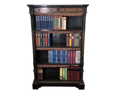 A fine Gillow & Co. high Victorian ebonised burr maple veneered parcel gilt and carved open bookcase, the shelves with leathe