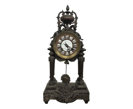 A French metal mantel clock, late 19th century, height 37.5cm.From the estate of Ashley Barker OBE who was born in Hertfordsh