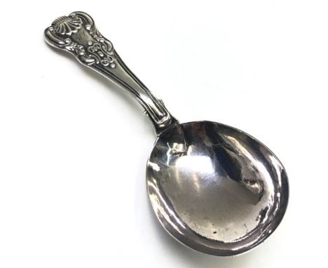 A George III silver Kings pattern caddy spoon by Joseph Taylor. 