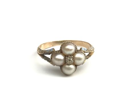 A late Victorian diamond and pearl cluster ring, the shank with traces of original blue enamel. 