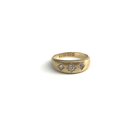 An 18ct gold ring gypsy set 3 diamonds Condition Report: 3.6 g