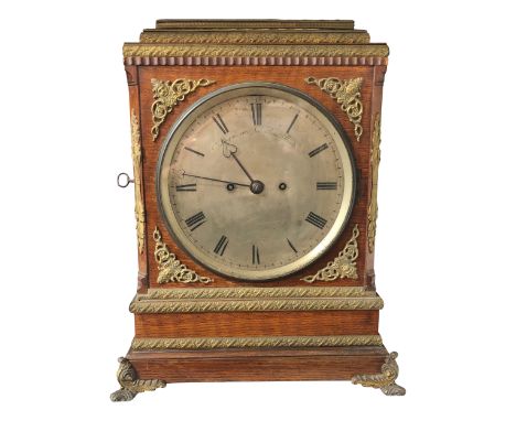 A Regency style oak bracket clock,19th century, with applied brass mounts, the circular silvered dial signed 'Payne 163, New 
