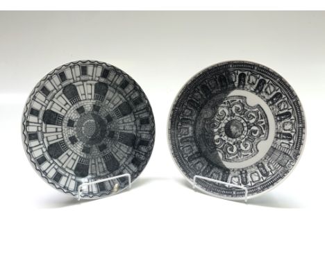 Two Fornasetti 'Cortili' plates decorated with monochrome architectural designs,  25.5cm diameter. From the estate of Ashley 