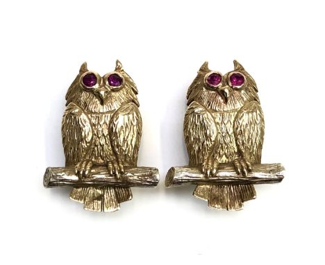 A pair of heavy 9ct gold owl earrings each with faceted ruby eyes, 18g.