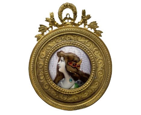Late 19th/early 20th century Limoges enamel plaque, circa 1900, painted with a portrait of Anette after Grasset, in circular 