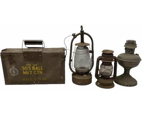 303 metal bound wooden ammunition box with folding handles, H23cm W40.5cm, together with three oil lamps. 