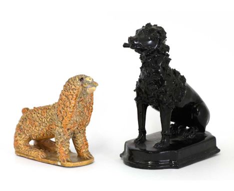 A Jackfield pottery figure of a poodle,19th century, seated with a stick in its mouth, on a shaped oval base,8cm wide15cm dee