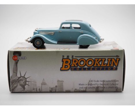 A BROOKLIN BRK.127 hand built white metal, 1:43 scale model of a 1934 Studebaker Commander land cruise sedan, VG/E in G/VG bo