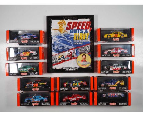 A group of boxed  1:43 scale models by QUARTZO, comprising of assorted NASCAR racing cars plus a book 'Speed Guts, &amp; Glor