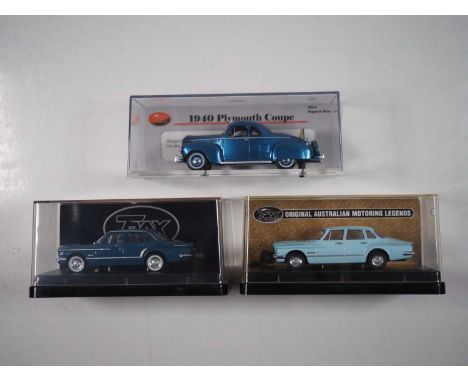 A group of 1:43 scale models of Australian cars by TRAX, comprising of a Plymouth coupe, Chrysler S Series Valiant and a Chry