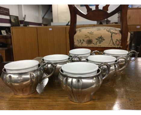 Six French silver cups with ceramic liners