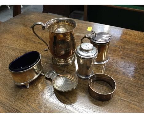 Silver christening mug, silver mustard pot, silver salt cellar, silver caddy spoon, silver napkin ring and silver pepperette,