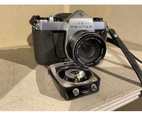 Pentax SP 500 and lens, together with a light meter