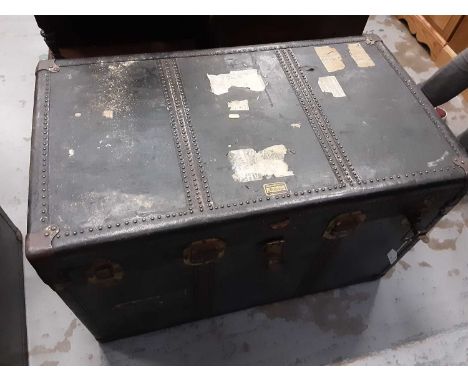 Old brass bound trunk with leather carrying handles, 96cm wide, 55cm deep, 61cm high, containing linen and wicker baskets