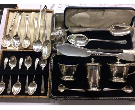 Three piece silver cruet set in case, set six silver coffee spoons in case, other silver flatware and a plated ladle 
