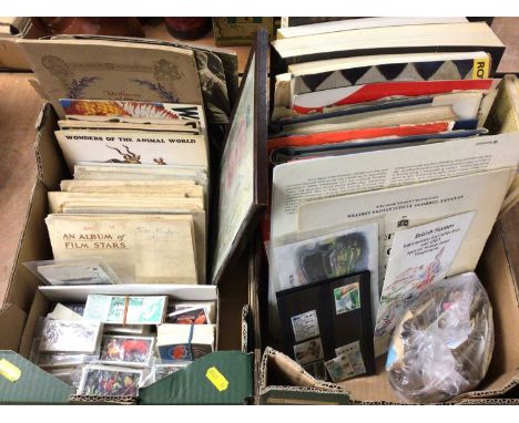 Two boxes containing cigarette cards, stamps and art books