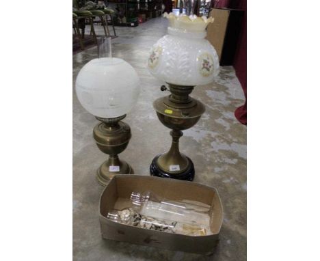 Early 20th century brass oil lamp with glass shade, together with another (2)