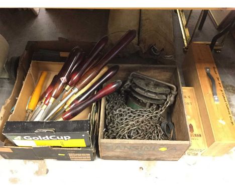 Set of lifting chains, together with various chisels and other tools