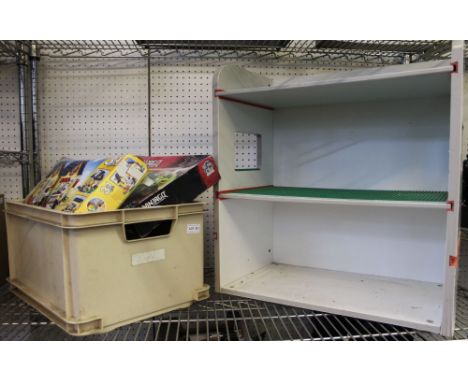 A box containing a good selection of Lego with boxed examples with a wooden Lego shelf