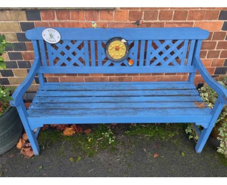 A blue painted garden bench