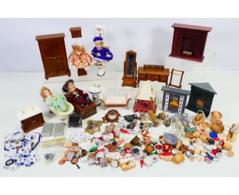 Dolls House - A collection of doll house furniture including fire places, radiators, bathroom suite, dresser, mirror, china w