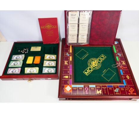 Franklin Mint - Scrabble - An unboxed Franklin Mint 'Collectors Edition' Monopoly set. The hardwood framed playing board with