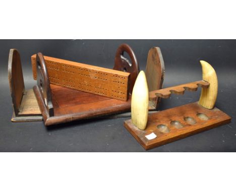 Tobaccania - a walrus tusk and oak pipe rack;  a folding book rack;  another Gothic;  a cribbage board (4)