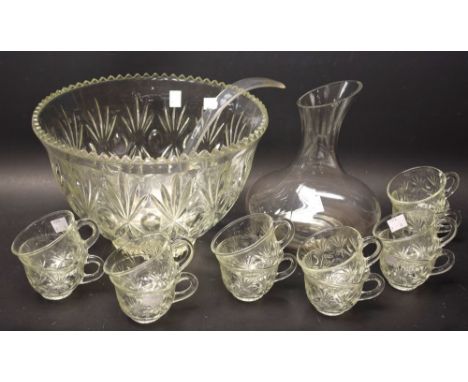 A pressed glass punch / mulled wine bowl, with twelve cups and plastic ladle; a wine carafe, boxed