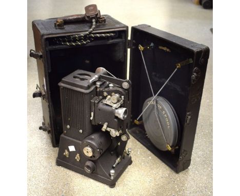 Photography/Cameras - a Specta Ltd projector, cased en suite with film reel tin, c.1940, instructions en suite; projection sc